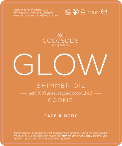 The COCOSOLIS Glow Shimmer Oil Label displaying 100% pure, organic ingredients and the products cookie scent