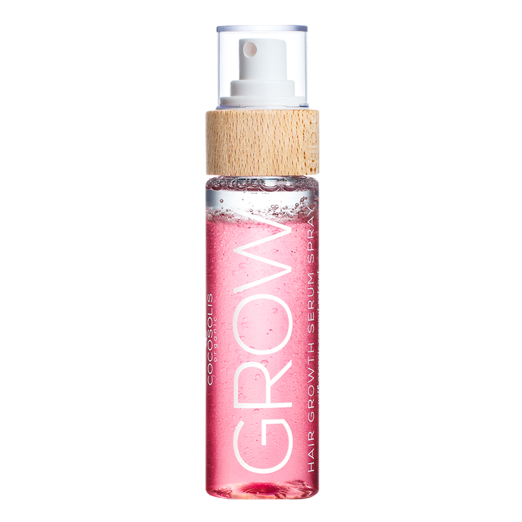 A bottle of the COCOSOLIS Grow Serum in a clear bottle showing the pink liquid with a bamboo top