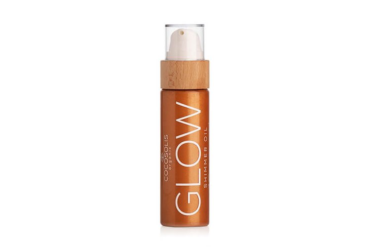 COCOSOLIS Glow Shimmer Oil in its clear bottle with a bamboo top